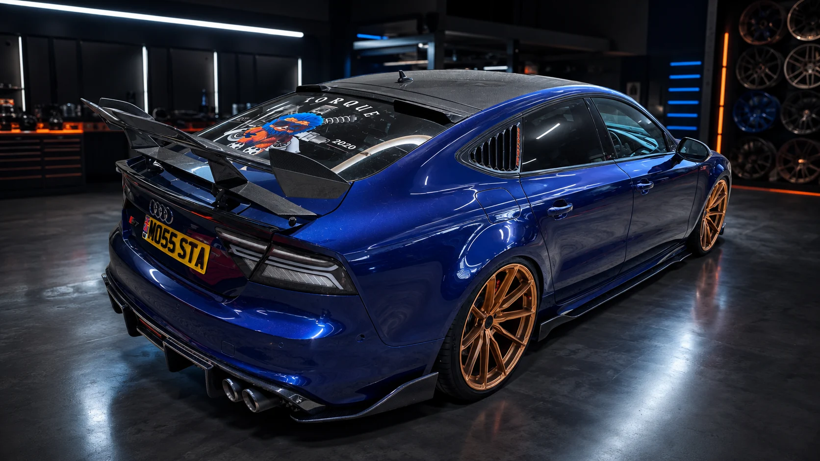 Current blue Torque Monsta Audi S7 with bronze wheels and carbon split rear wing